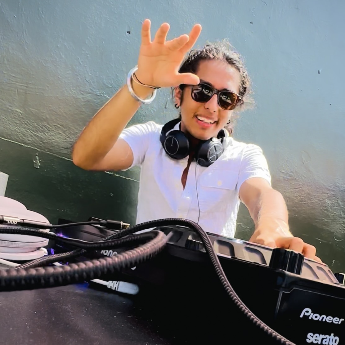 DJ RoAr energizing the crowd from behind his decks